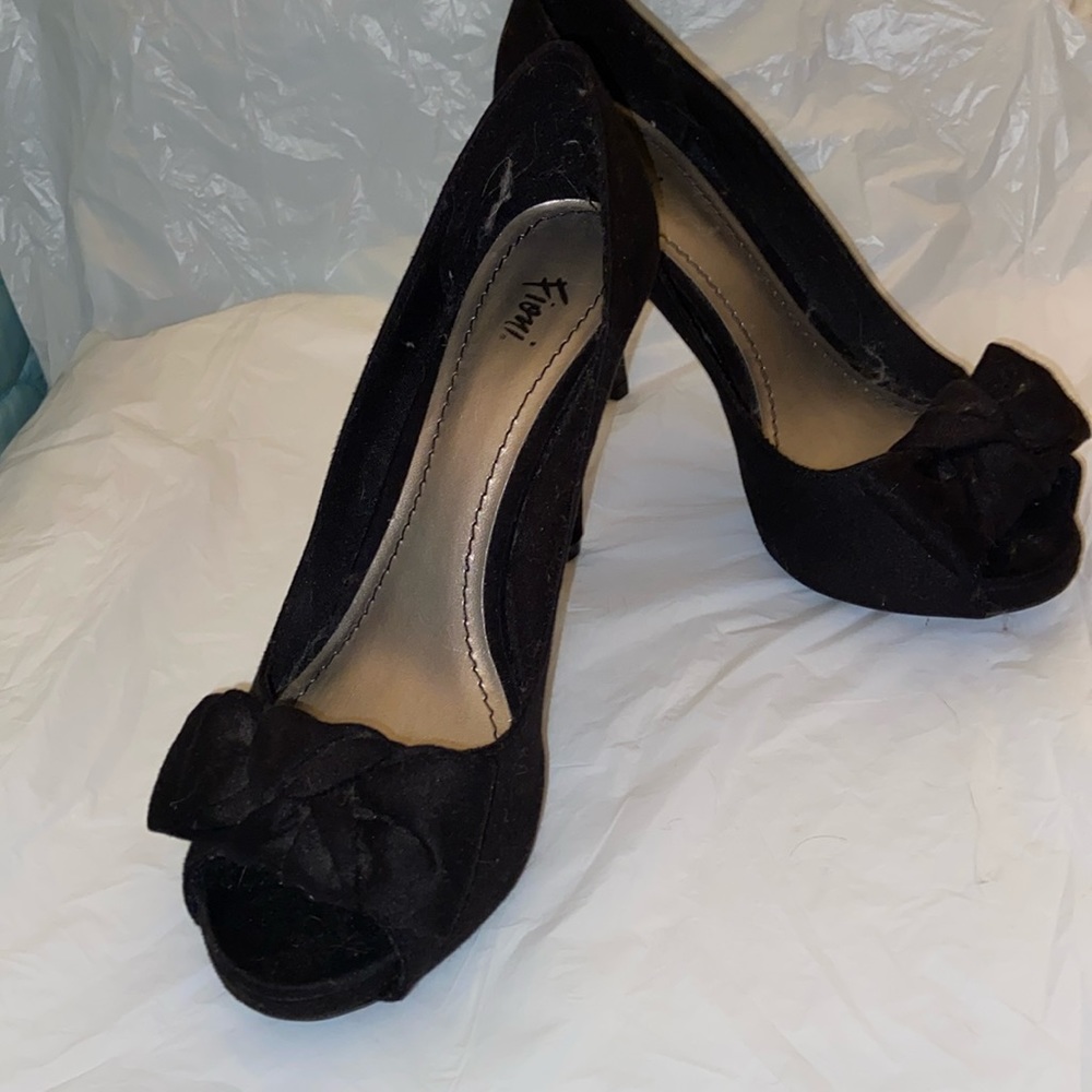 Black peep toe heels with bow detail.